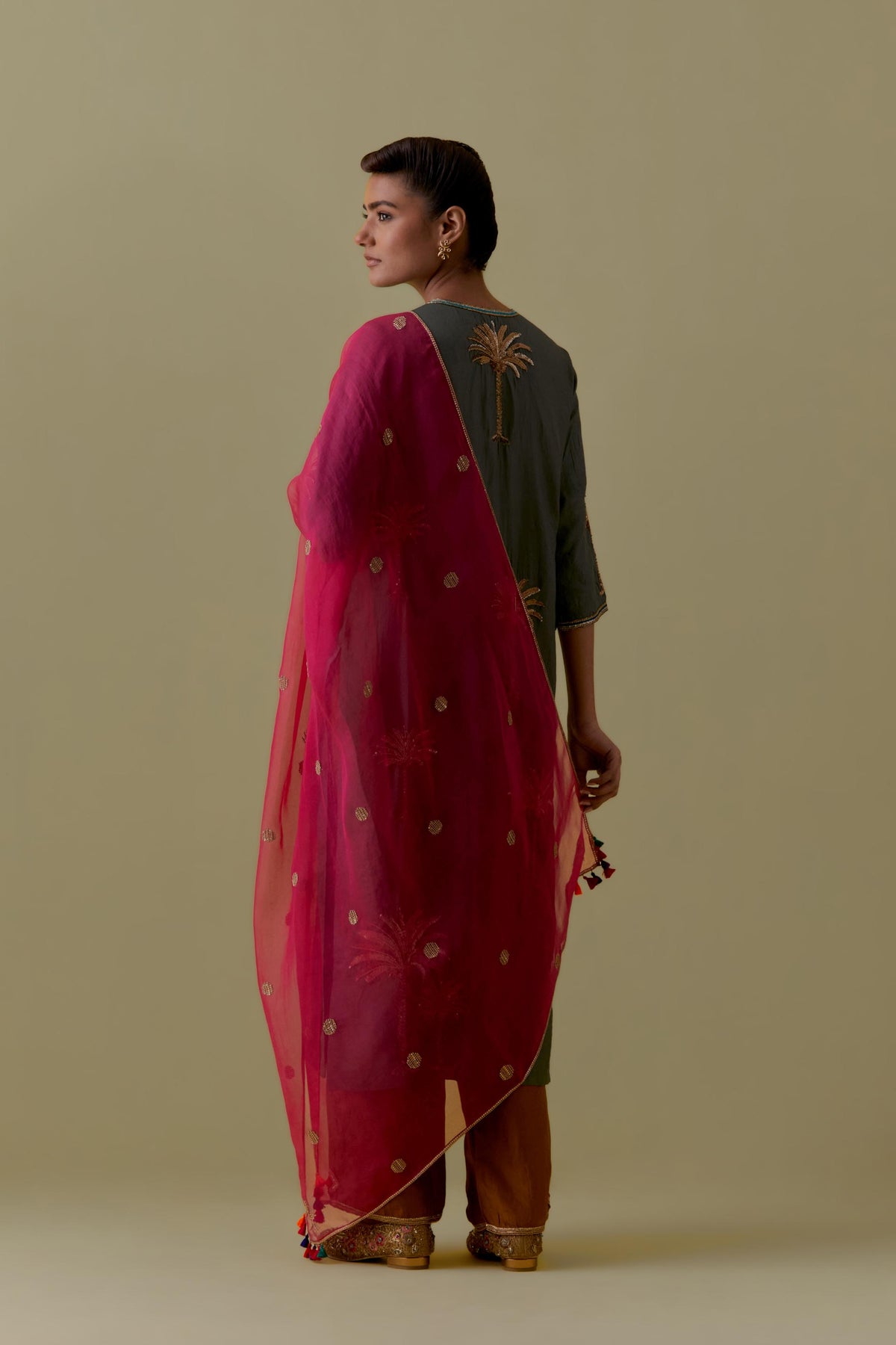 Green silk straight Kurta set with Hand-Worked Palm Motifs.