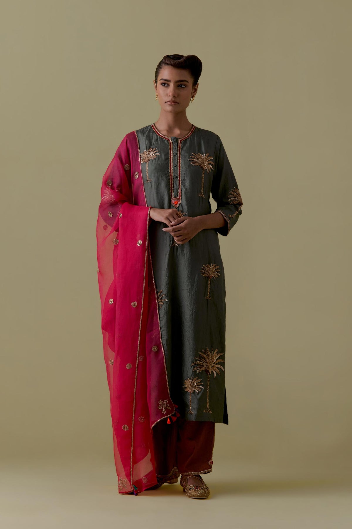 Green silk straight Kurta set with Hand-Worked Palm Motifs.