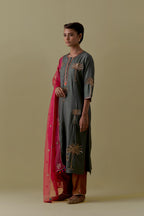Green silk straight Kurta set with Hand-Worked Palm Motifs.