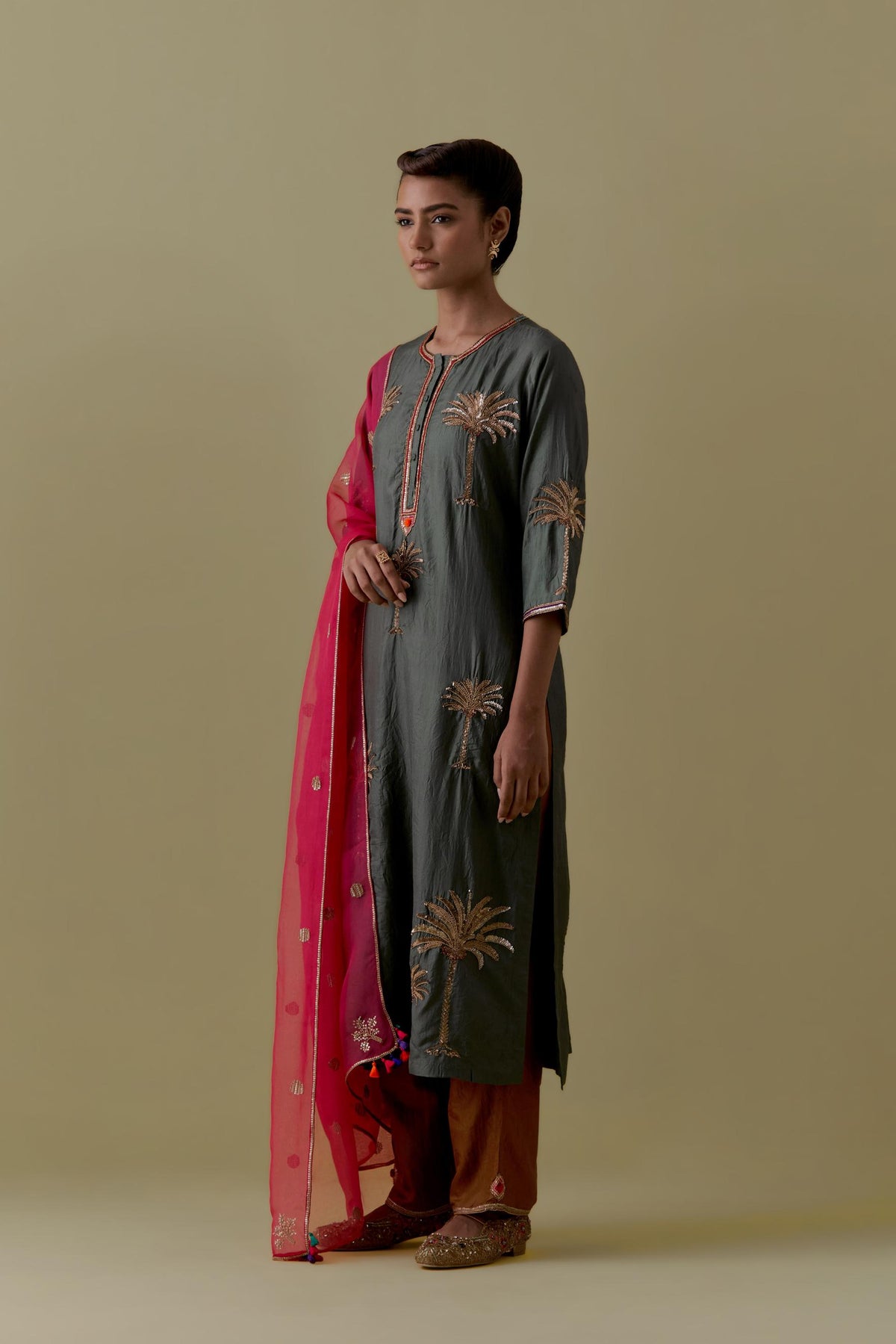 Green silk straight Kurta set with Hand-Worked Palm Motifs.