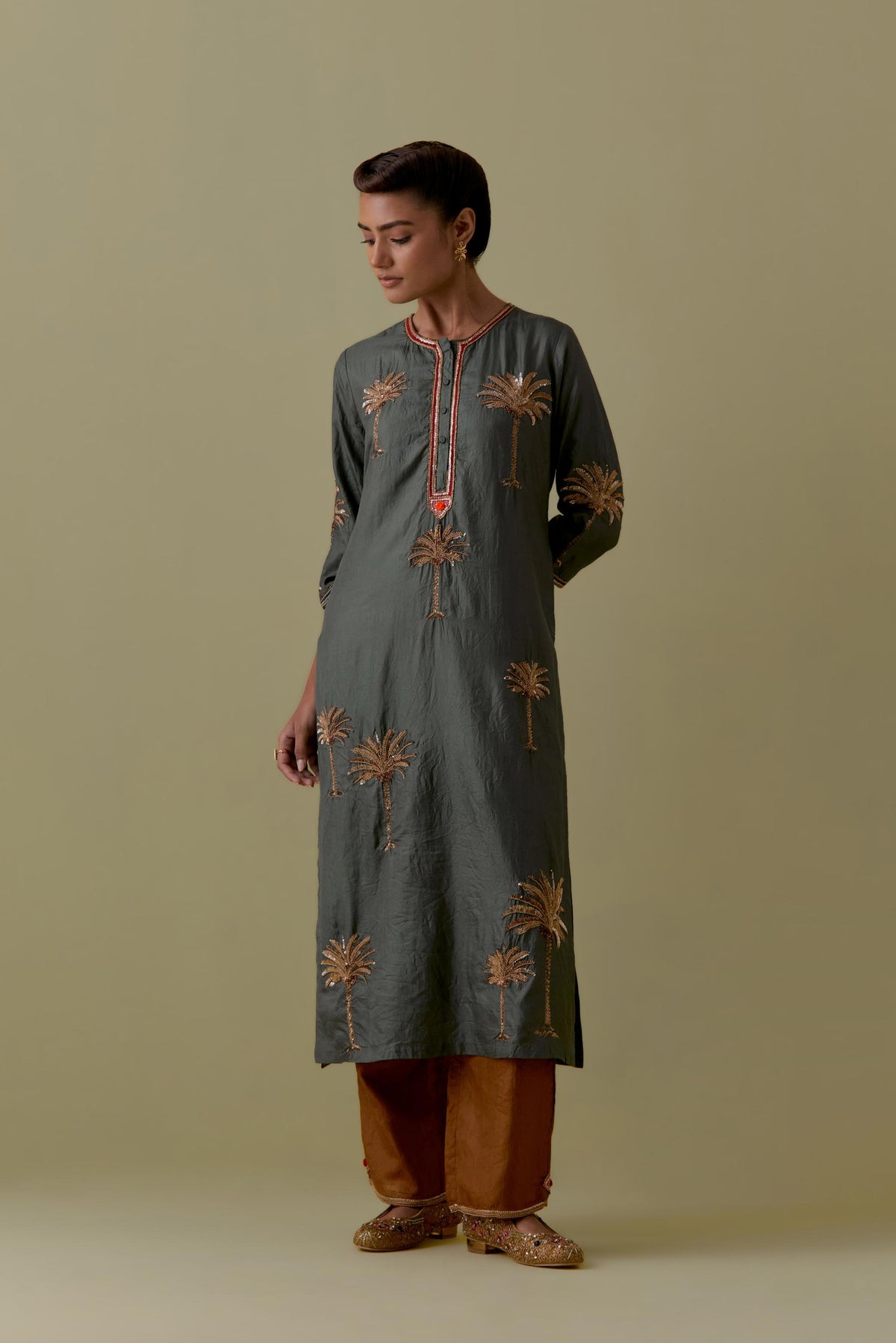 Green silk straight Kurta set with Hand-Worked Palm Motifs.