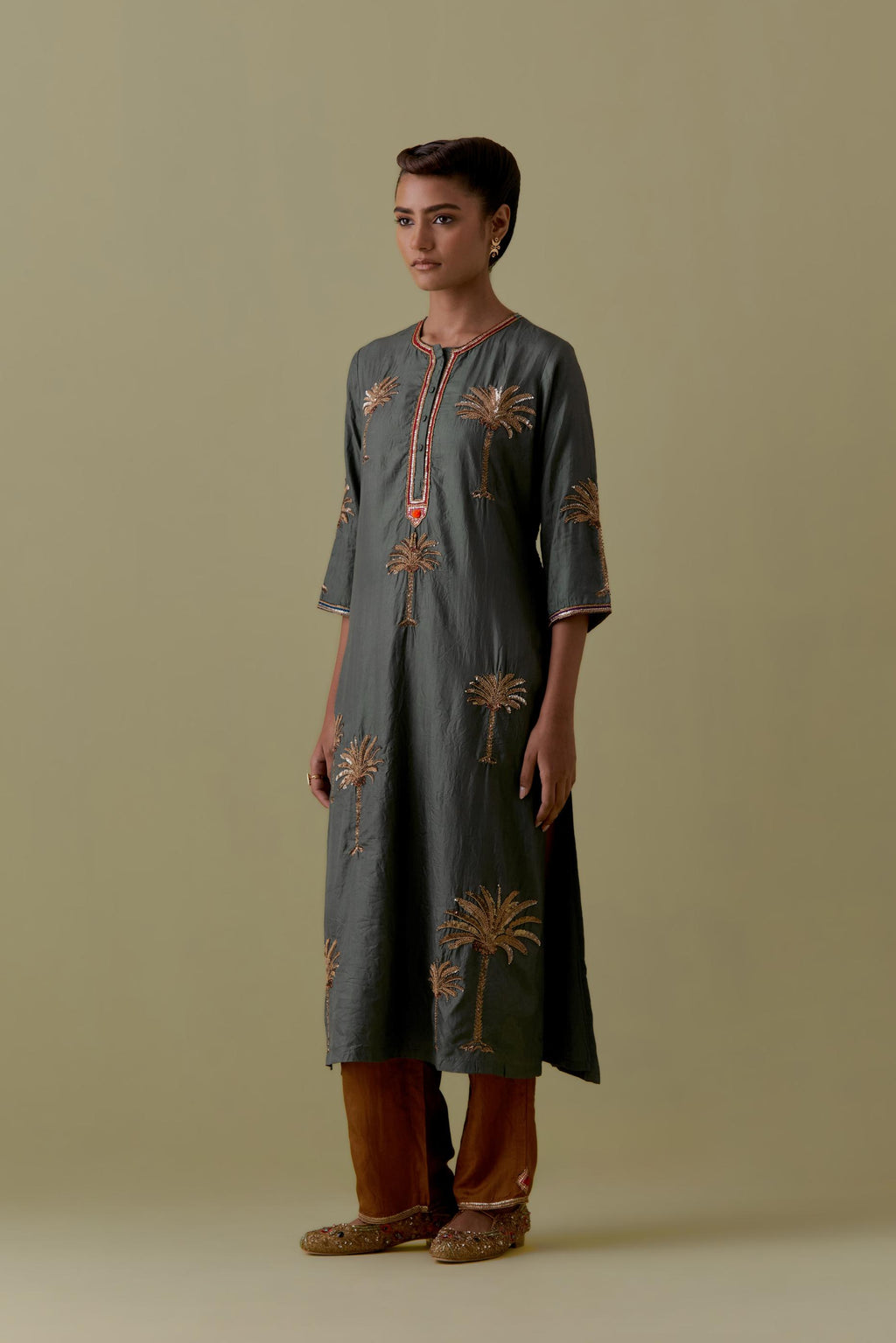 Green silk straight Kurta set with Hand-Worked Palm Motifs.