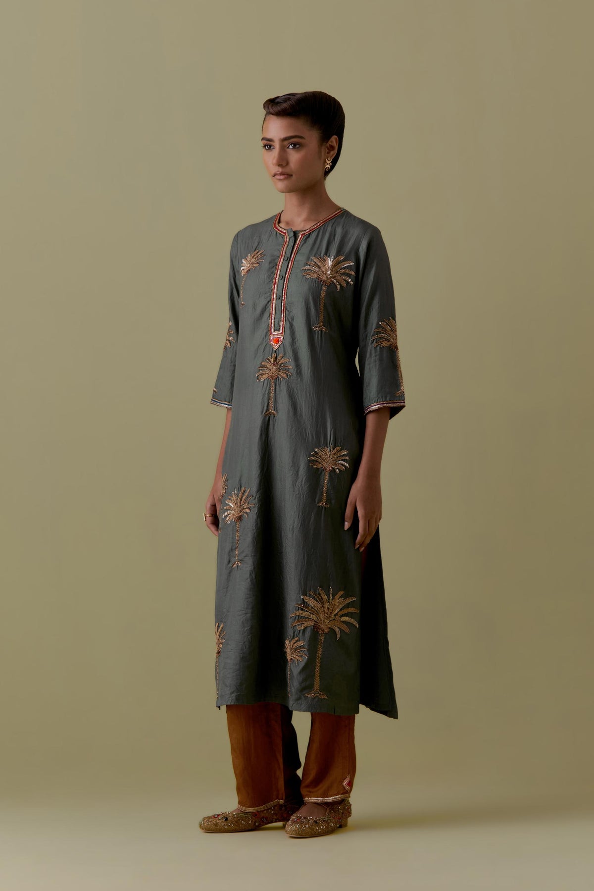 Green silk straight Kurta set with Hand-Worked Palm Motifs.