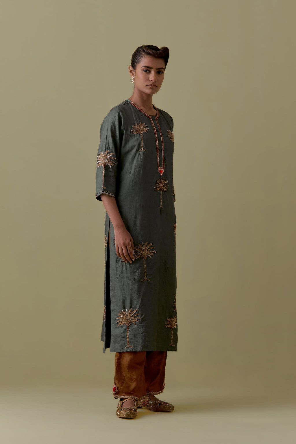 Green silk straight Kurta set with Hand-Worked Palm Motifs.