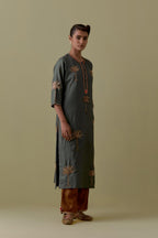 Green silk straight Kurta set with Hand-Worked Palm Motifs.