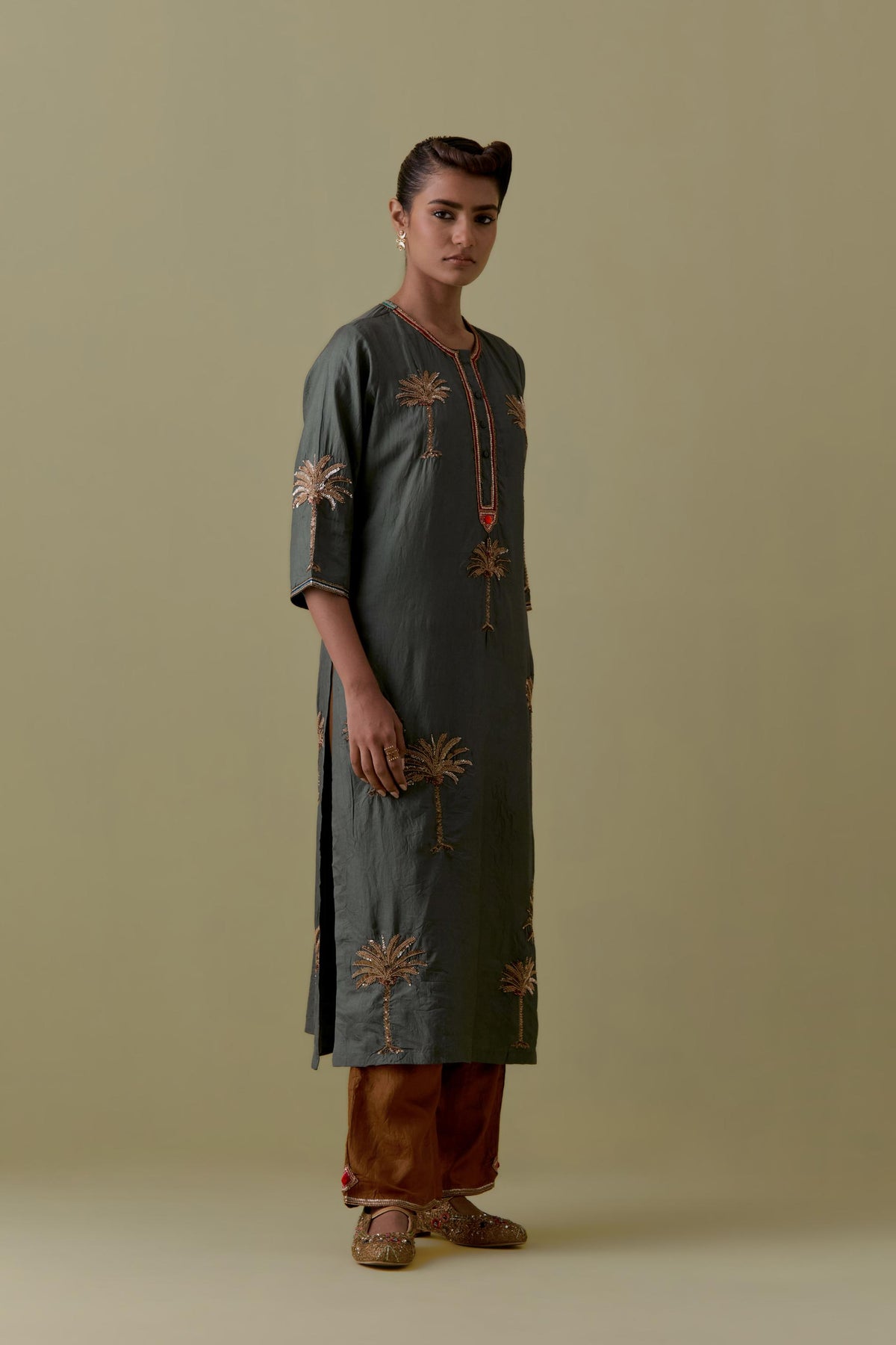 Green silk straight Kurta set with Hand-Worked Palm Motifs.