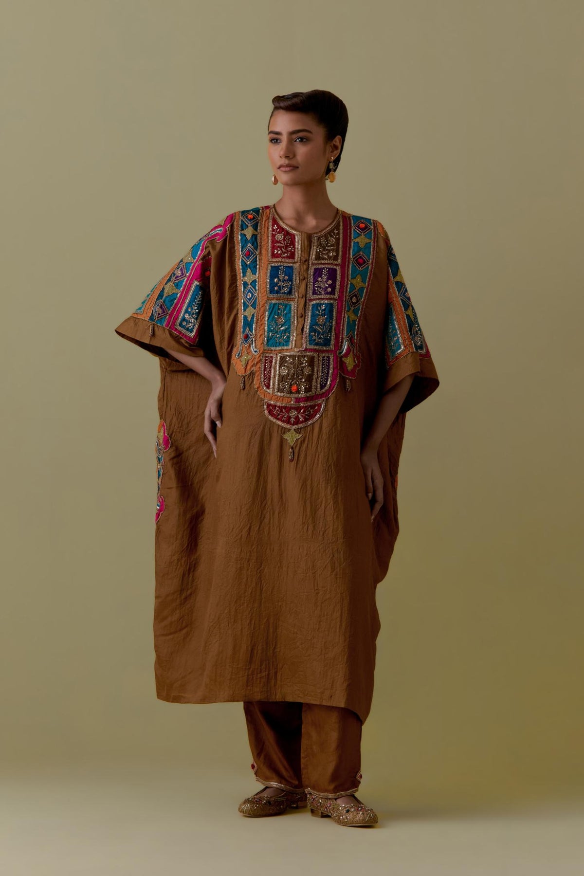 Olive Kaftan with Multicoloured Appliqué & Handwork. Paired with olive Silk Hand-Block Printed Straight Pants with hand work at hem.
