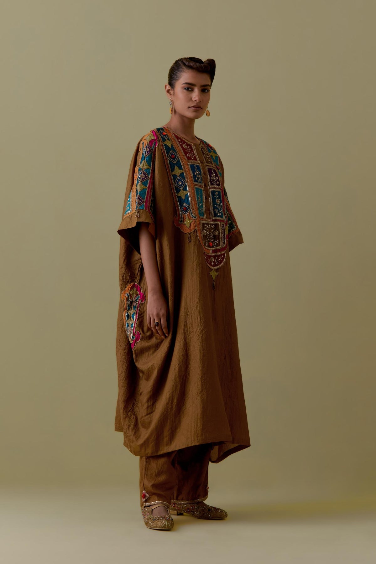 Olive Kaftan with Multicoloured Appliqué & Handwork. Paired with olive Silk Hand-Block Printed Straight Pants with hand work at hem.