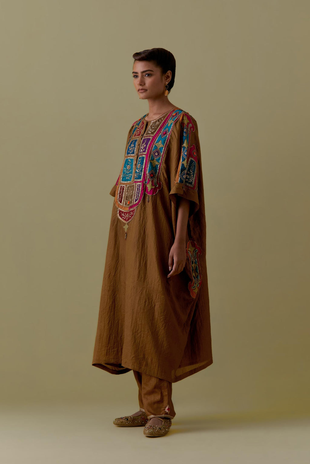 Olive Kaftan with Multicoloured Appliqué & Handwork. Paired with olive Silk Hand-Block Printed Straight Pants with hand work at hem.
