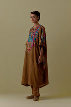Olive Kaftan with Multicoloured Appliqué & Handwork. Paired with olive Silk Hand-Block Printed Straight Pants with hand work at hem.