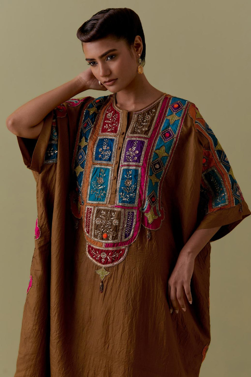 Olive Kaftan with Multicoloured Appliqué & Handwork. Paired with olive Silk Hand-Block Printed Straight Pants with hand work at hem.