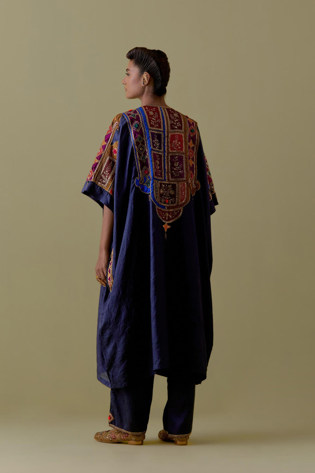 Indigo Kaftan with Multicoloured Appliqué & Handwork. Paired with Indigo Silk Hand-Block Printed Straight Pants with hand work at hem.