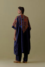 Indigo Kaftan with Multicoloured Appliqué & Handwork. Paired with Indigo Silk Hand-Block Printed Straight Pants with hand work at hem.