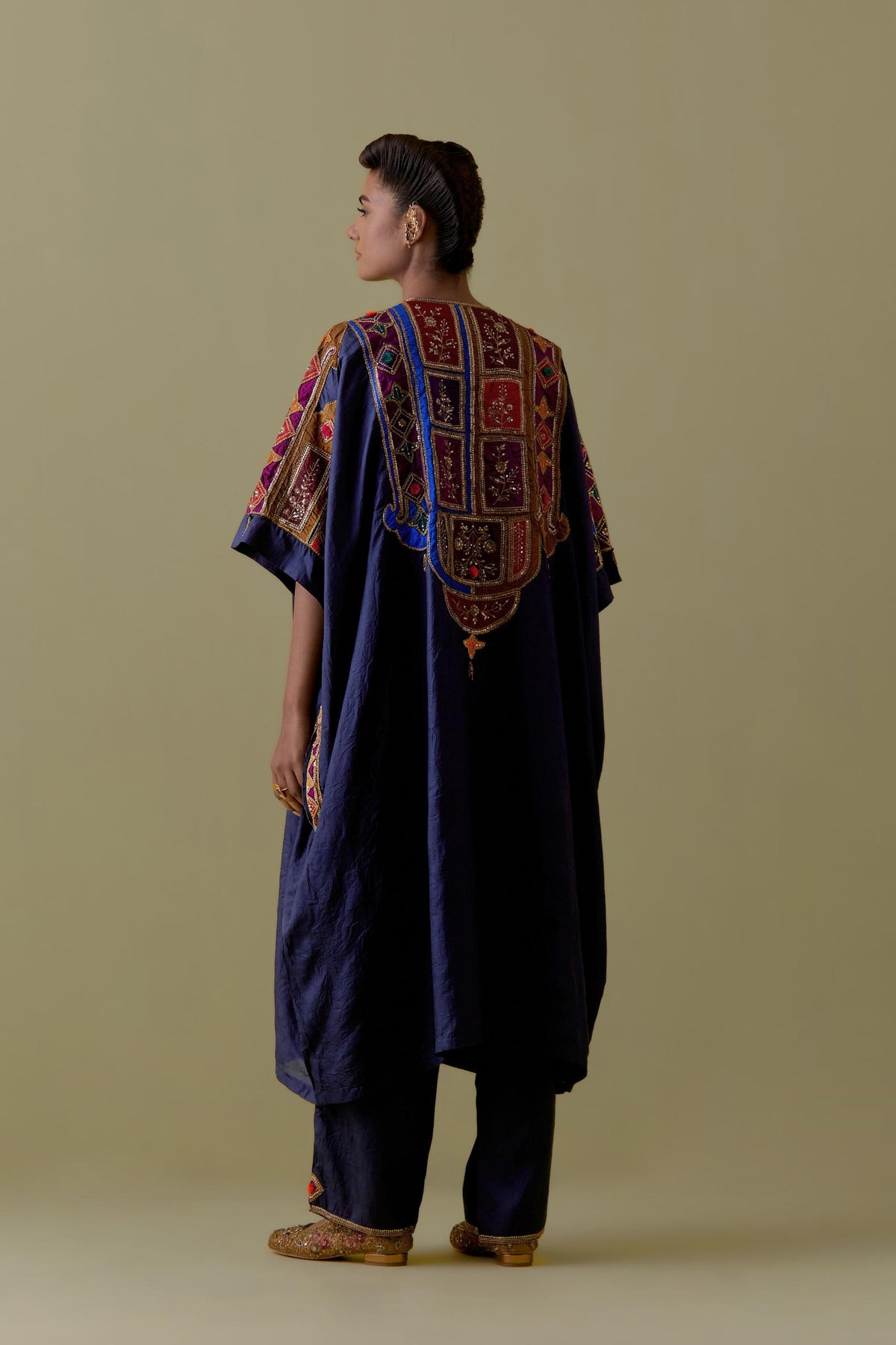 Indigo Kaftan with Multicoloured Appliqué & Handwork. Paired with Indigo Silk Hand-Block Printed Straight Pants with hand work at hem.