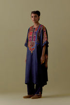 Indigo Kaftan with Multicoloured Appliqué & Handwork. Paired with Indigo Silk Hand-Block Printed Straight Pants with hand work at hem.