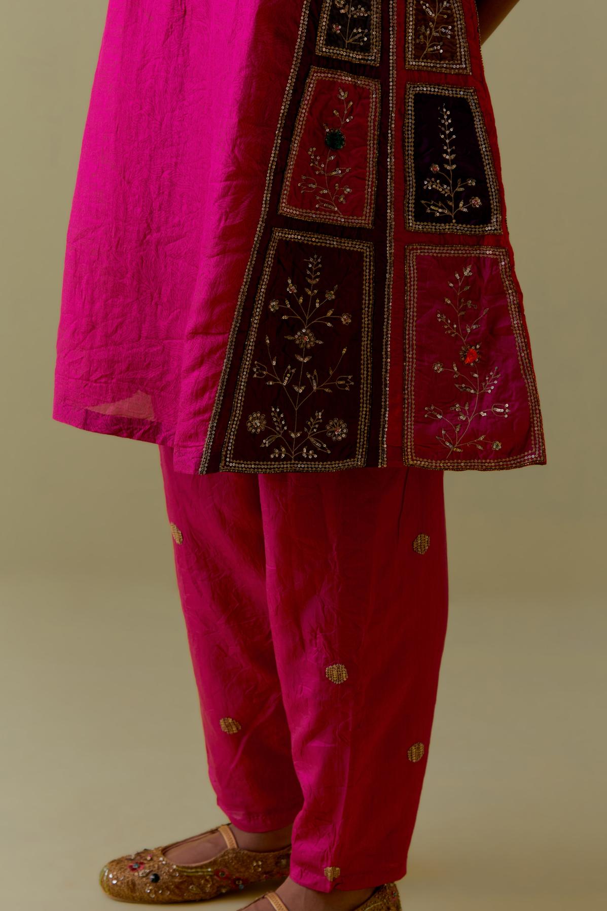 Fuchsia Silk Kalidar Kurta with Multicoloured Appliqué. Paired with fuchsia Silk Salwar with Gold seuins and bead Handwork