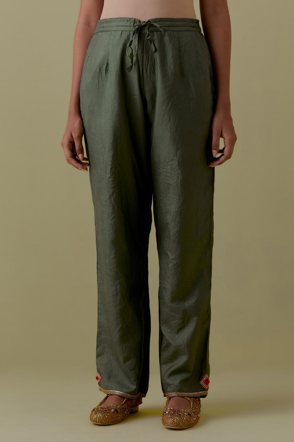 Green Silk Hand-Block Printed Straight Pants with hand work at hem.