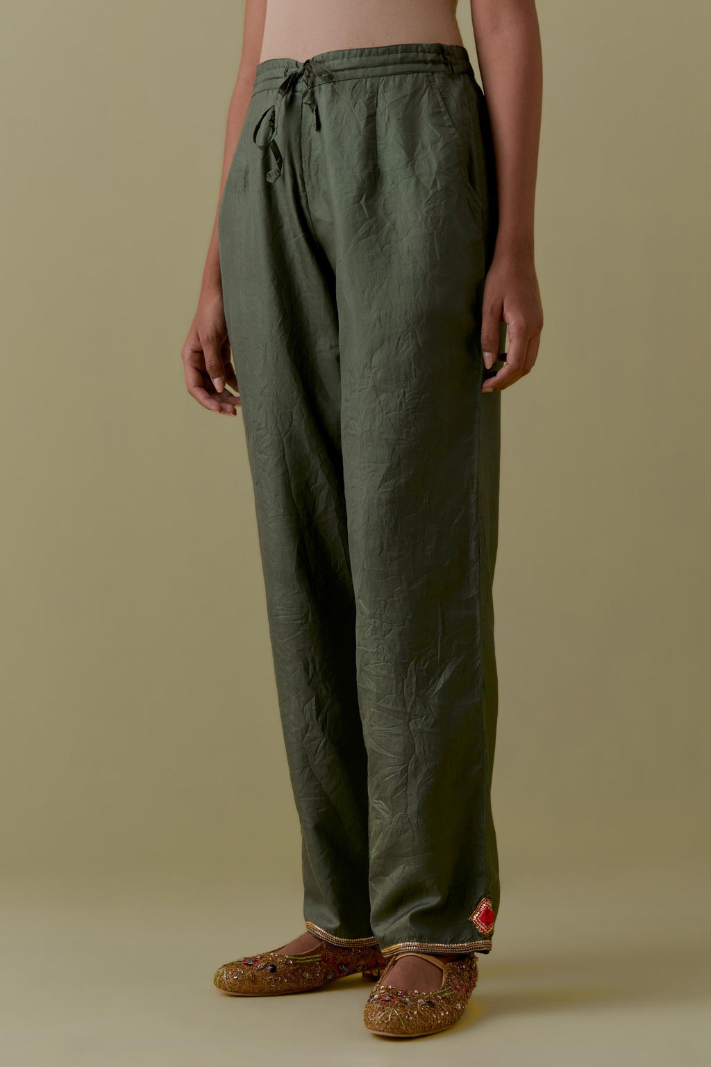 Green Silk Hand-Block Printed Straight Pants with hand work at hem.