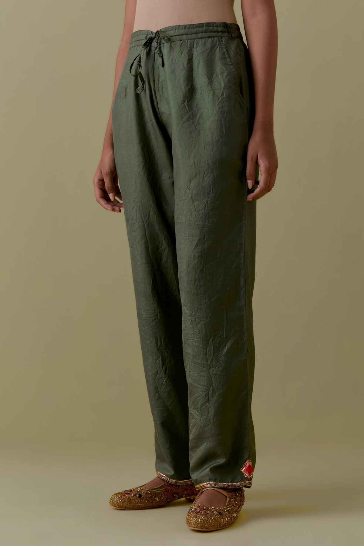 Green Silk Hand-Block Printed Straight Pants with hand work at hem.