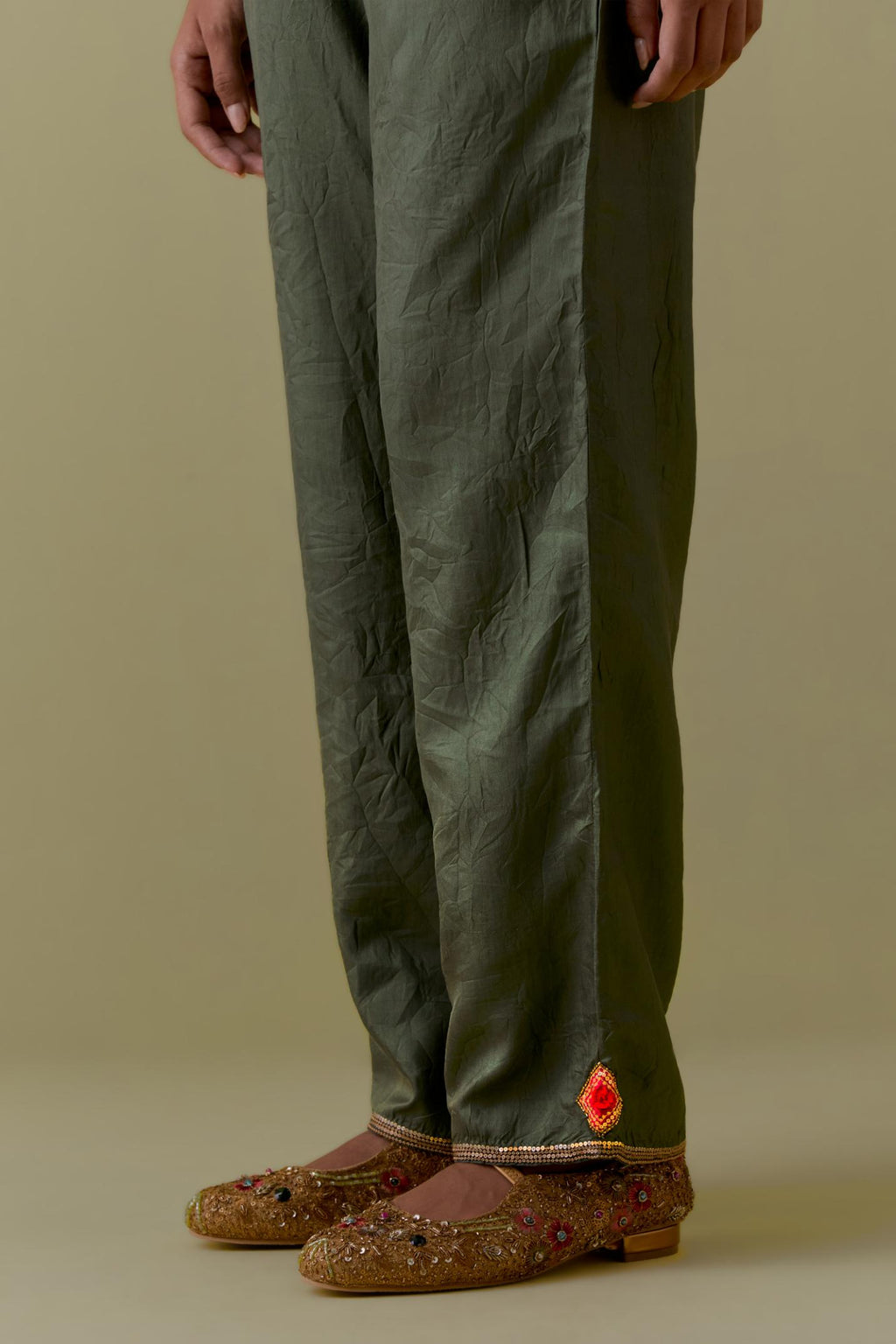 Green Silk Hand-Block Printed Straight Pants with hand work at hem.