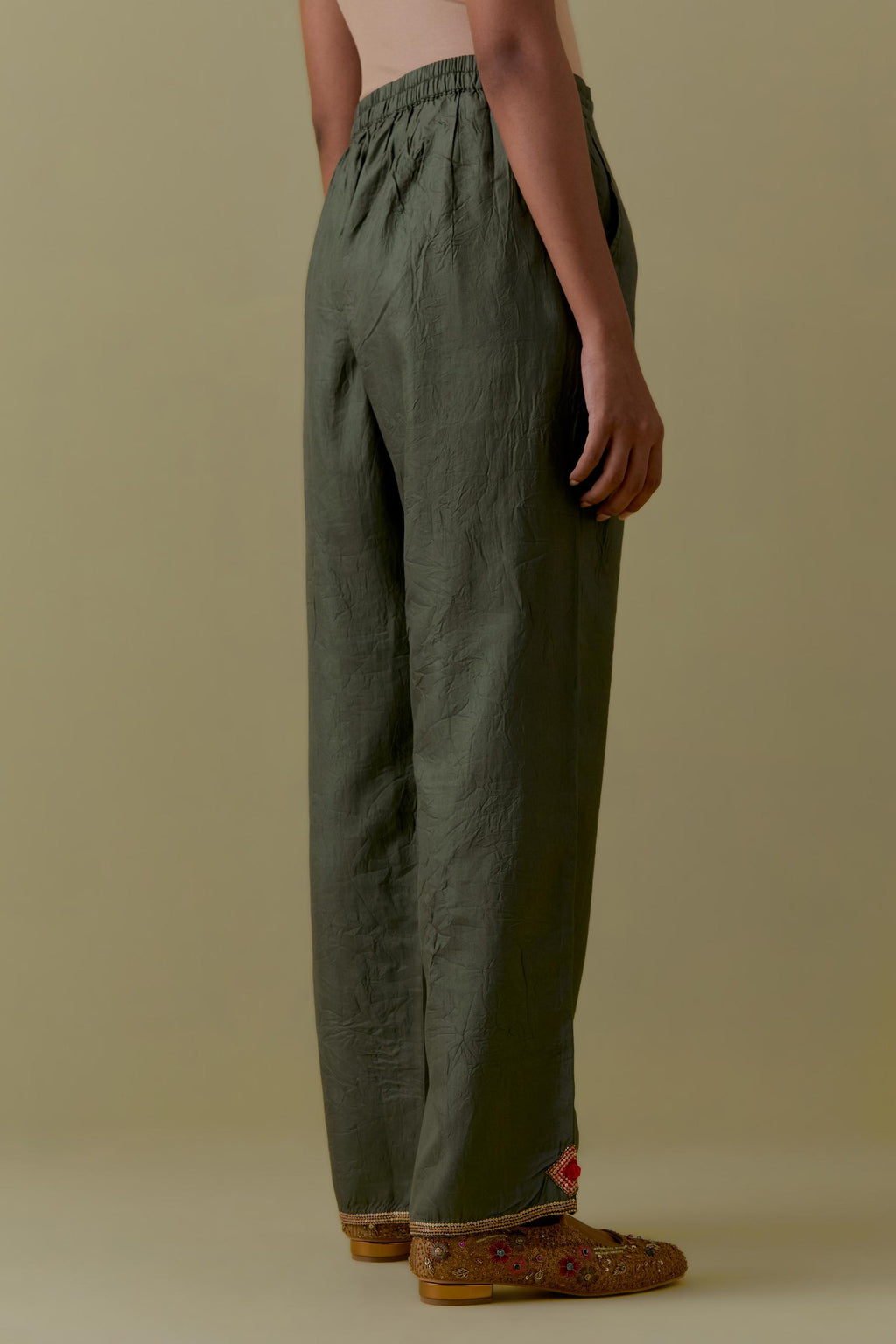 Green Silk Hand-Block Printed Straight Pants with hand work at hem.