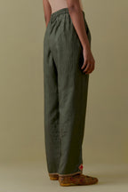 Green Silk Hand-Block Printed Straight Pants with hand work at hem.