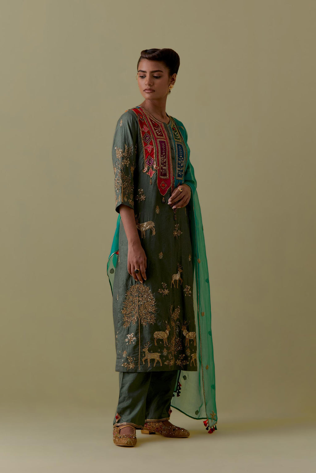 Green silk striaght Kurta set with Multicoloured Appliqué & Deer Motifs.
