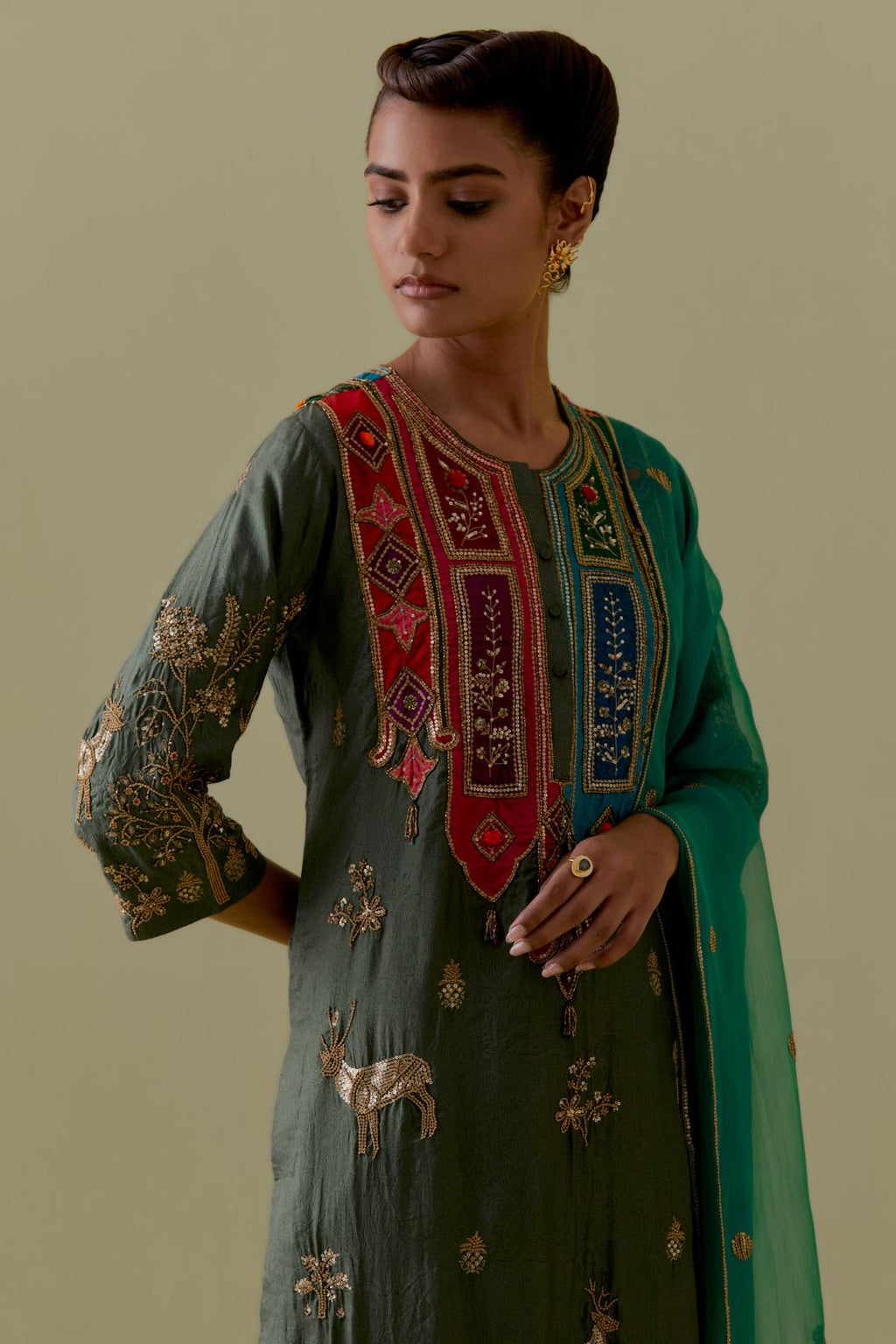 Green silk striaght Kurta set with Multicoloured Appliqué & Deer Motifs.