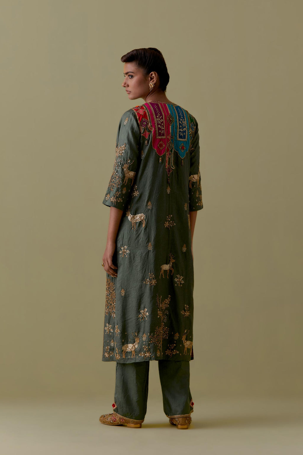 Green silk striaght Kurta set with Multicoloured Appliqué & Deer Motifs.