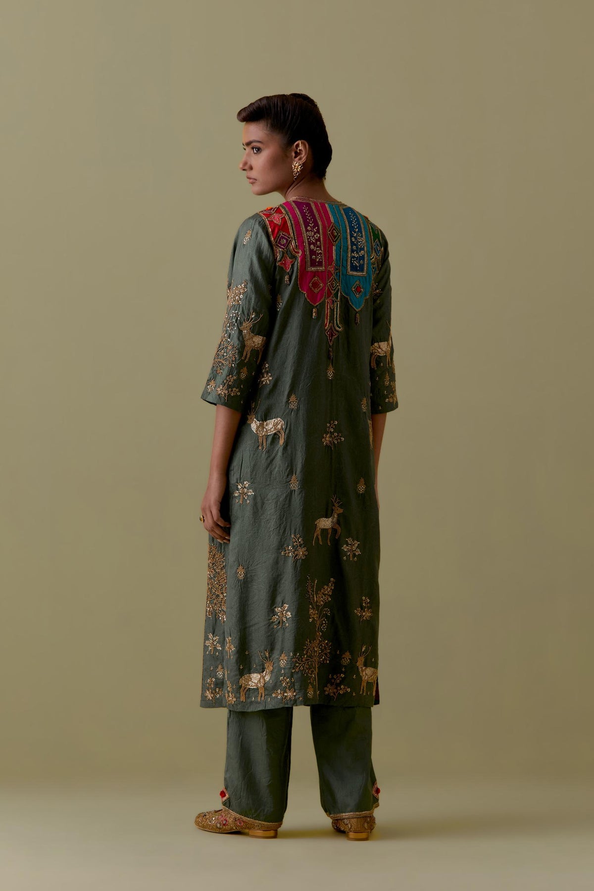 Green silk striaght Kurta set with Multicoloured Appliqué & Deer Motifs.