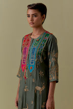 Green silk striaght Kurta set with Multicoloured Appliqué & Deer Motifs.