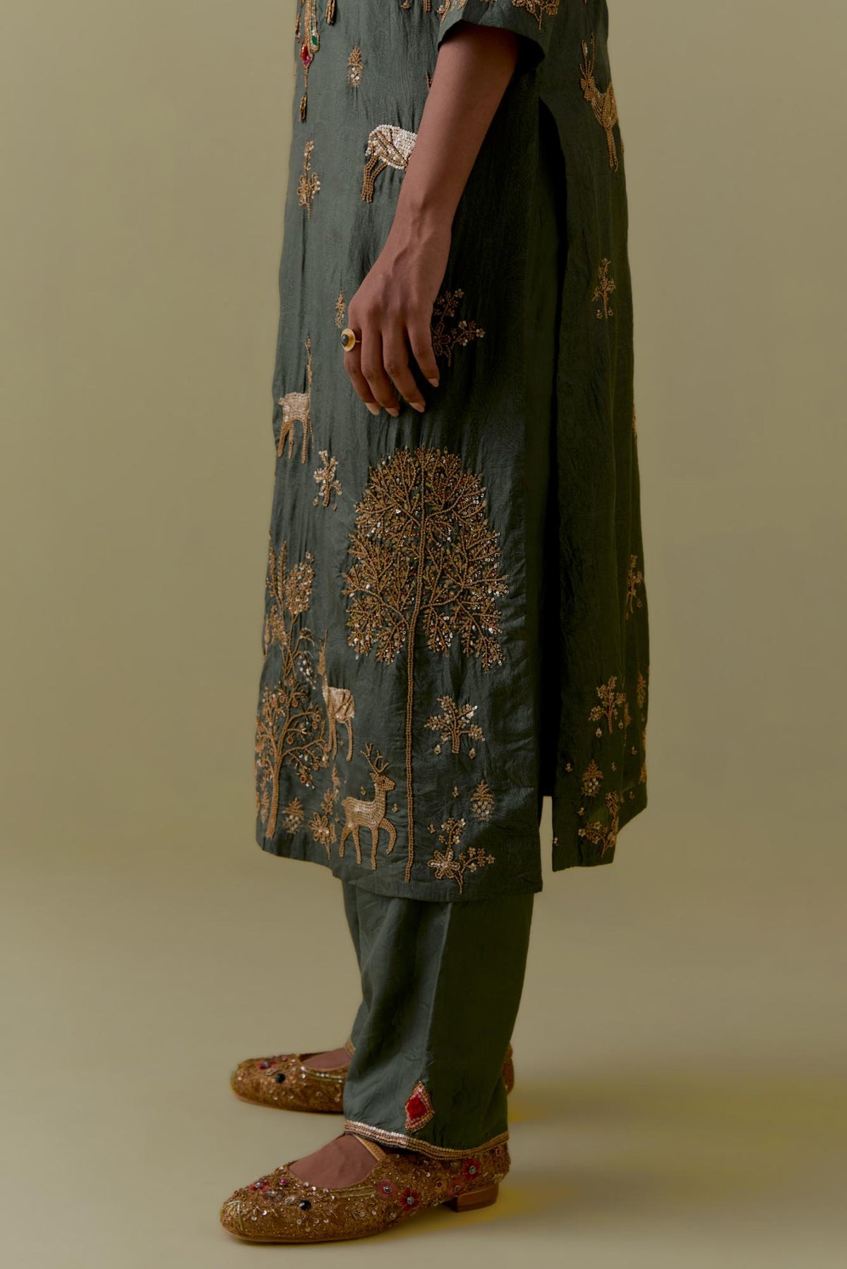 Green silk striaght Kurta set with Multicoloured Appliqué & Deer Motifs.