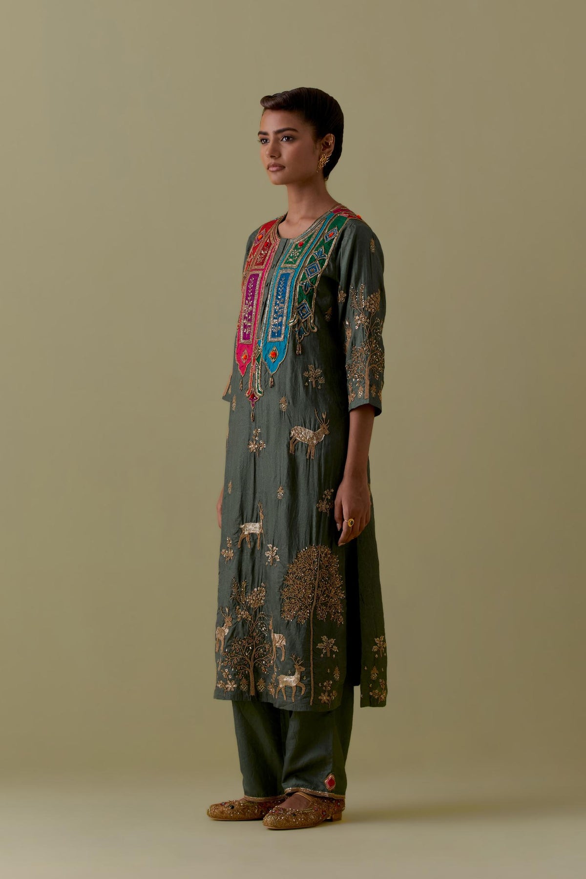 Green silk striaght Kurta set with Multicoloured Appliqué & Deer Motifs.