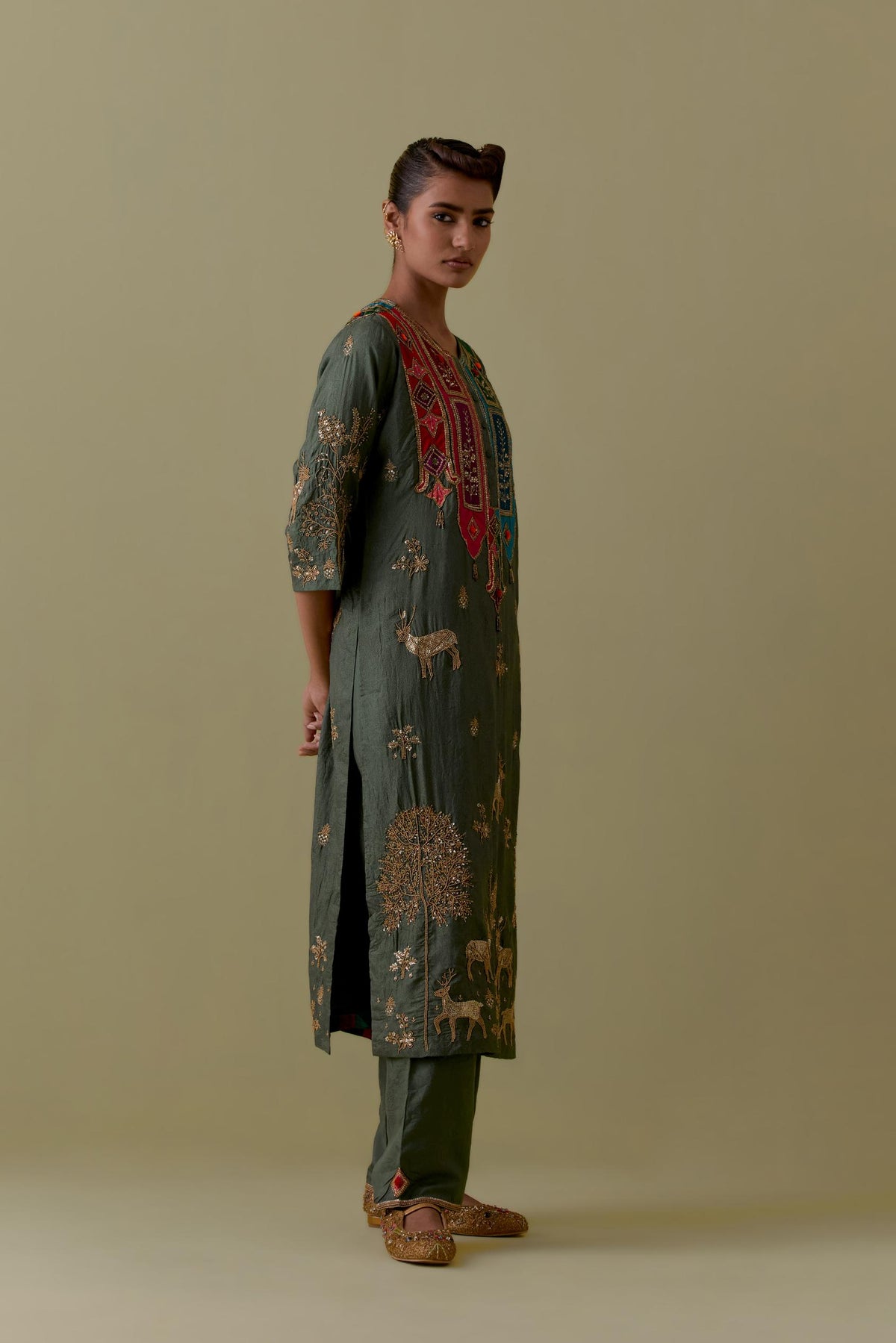 Green silk striaght Kurta set with Multicoloured Appliqué & Deer Motifs.