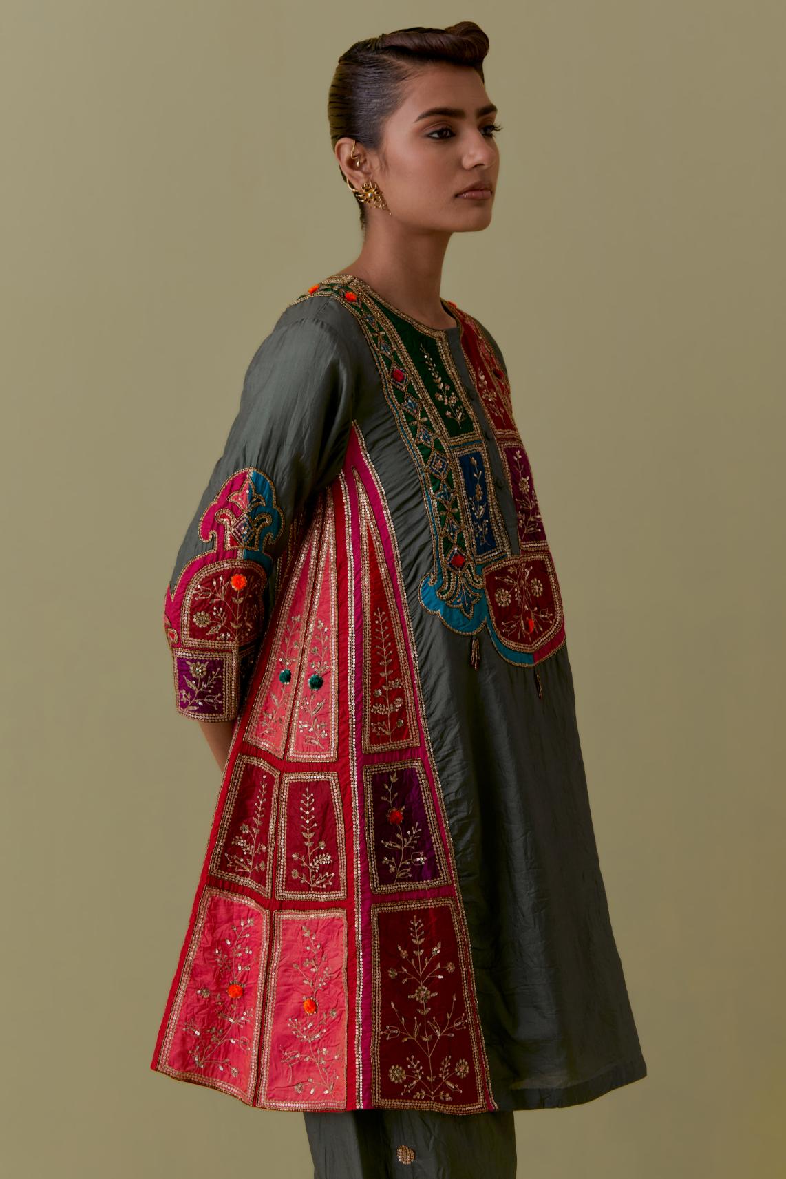 Green Silk Kalidar Kurta with Multicoloured Appliqué. Paired with green Silk Salwar with Gold seuins and bead Handwork