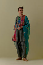 Green Silk Kalidar Kurta with Multicoloured Appliqué. Paired with green Silk Salwar with Gold seuins and bead Handwork