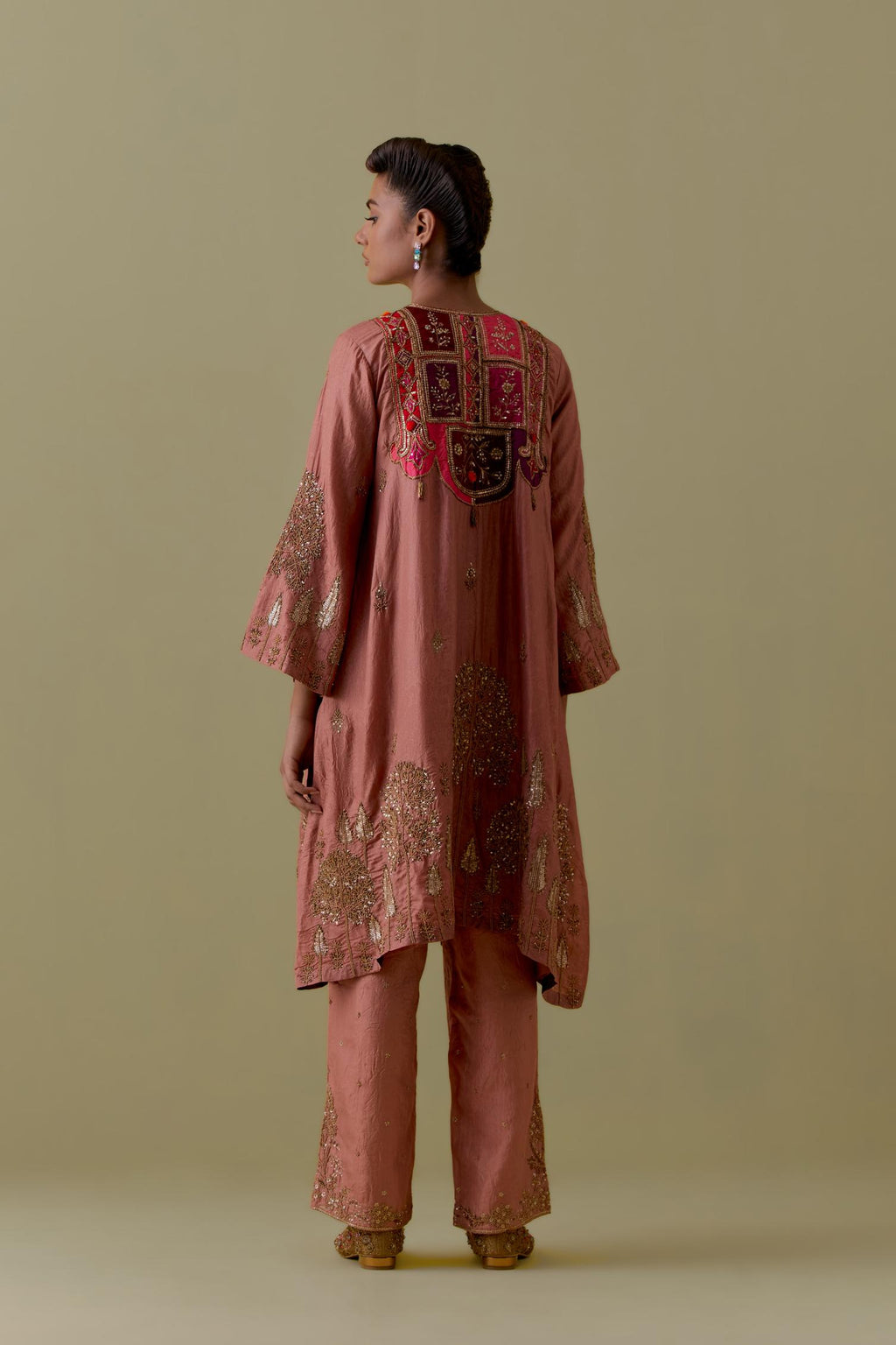 Peach A-Line silk short Kurta set with Multicoloured Appliqué & Gold Handwork.