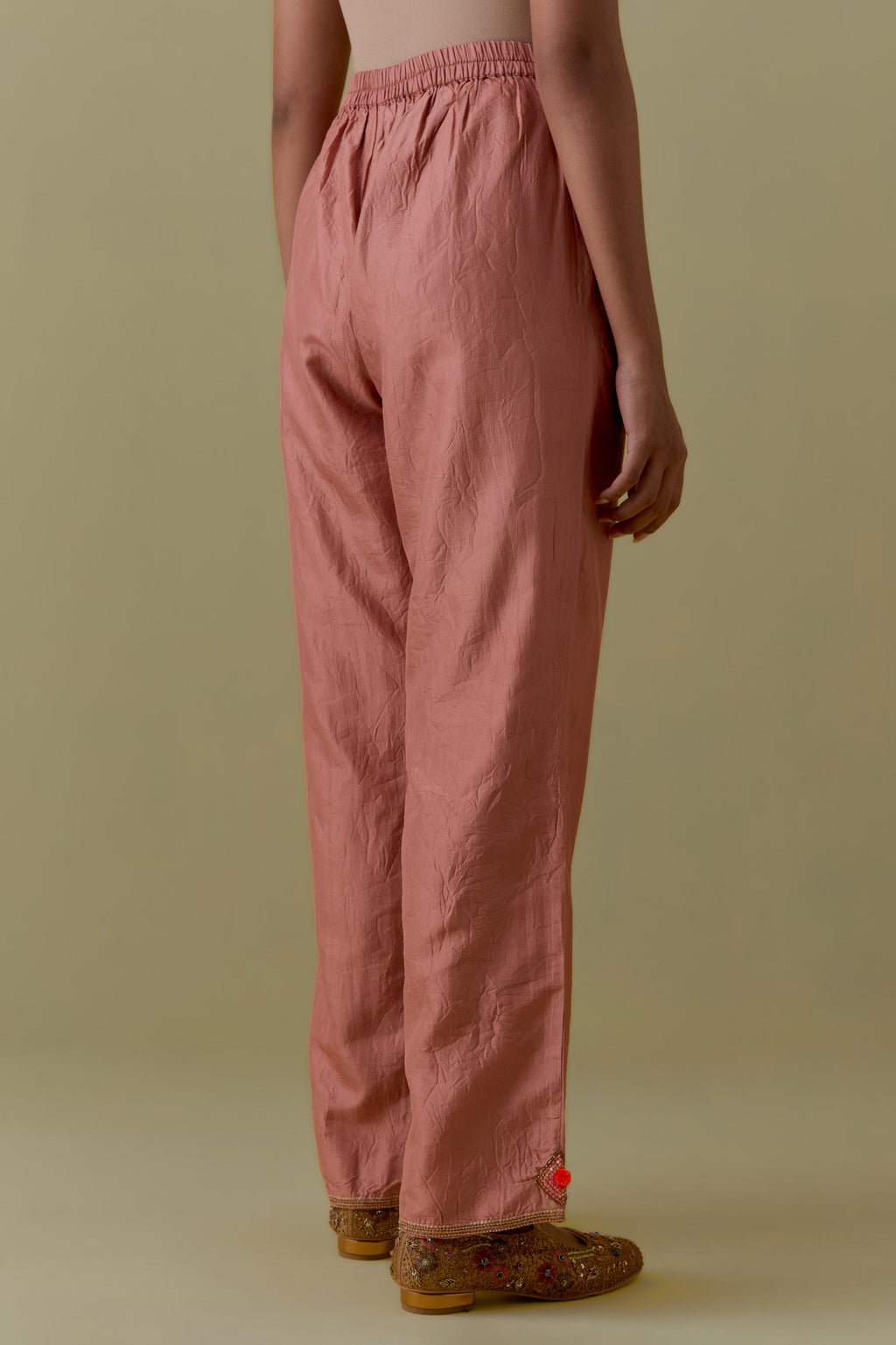 Peach Silk Hand-Block Printed Straight Pants with hand work at hem.