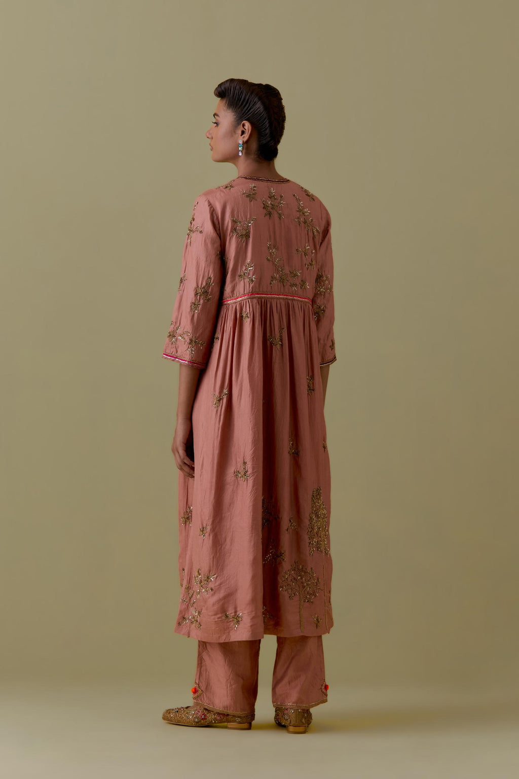 Peach silk Kurta set with hand worked Floral & Tree Motifs.