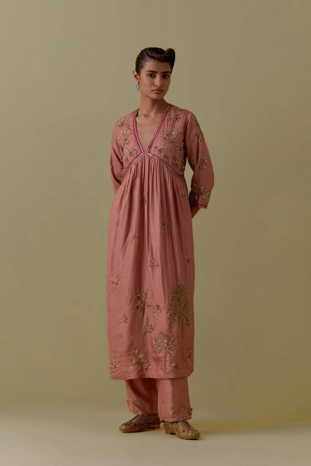 Peach silk Kurta set with hand worked Floral & Tree Motifs.