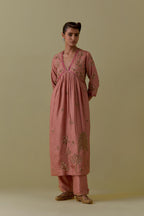 Peach silk Kurta set with hand worked Floral & Tree Motifs.