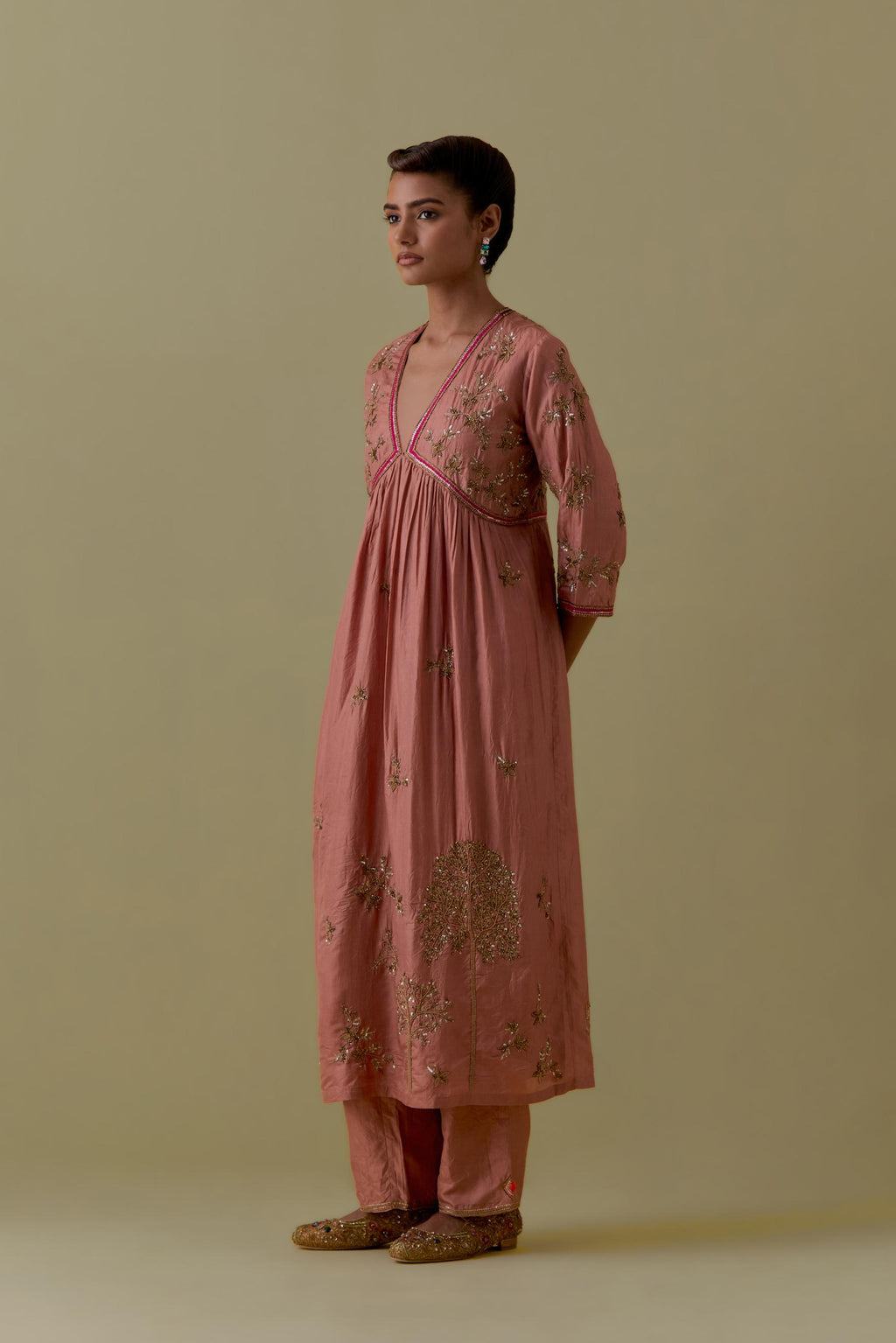 Peach silk Kurta set with hand worked Floral & Tree Motifs.