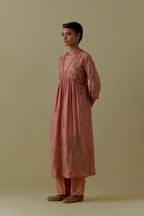 Peach silk Kurta set with hand worked Floral & Tree Motifs.