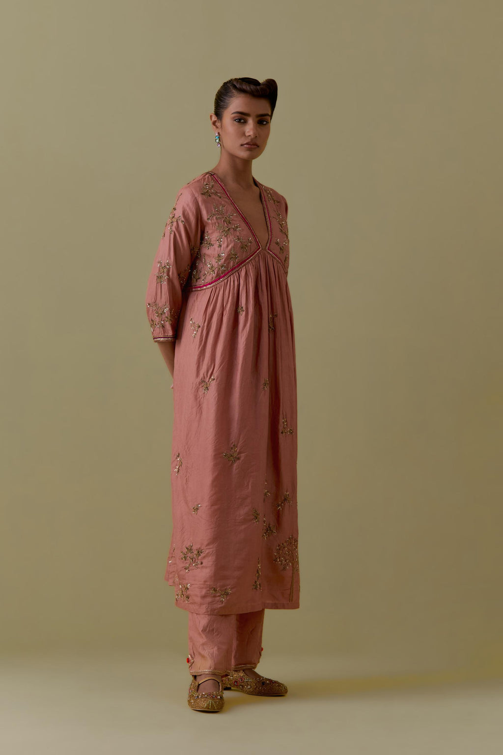 Peach silk Kurta set with hand worked Floral & Tree Motifs.
