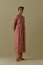 Peach silk Kurta set with hand worked Floral & Tree Motifs.