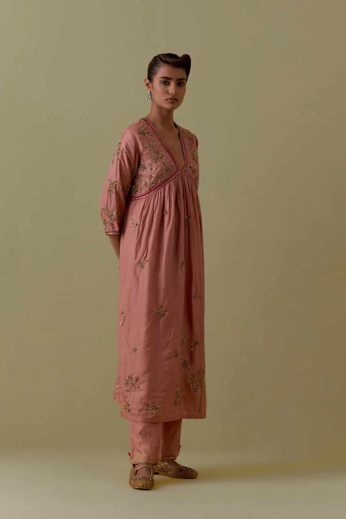 Peach silk Kurta set with hand worked Floral & Tree Motifs.