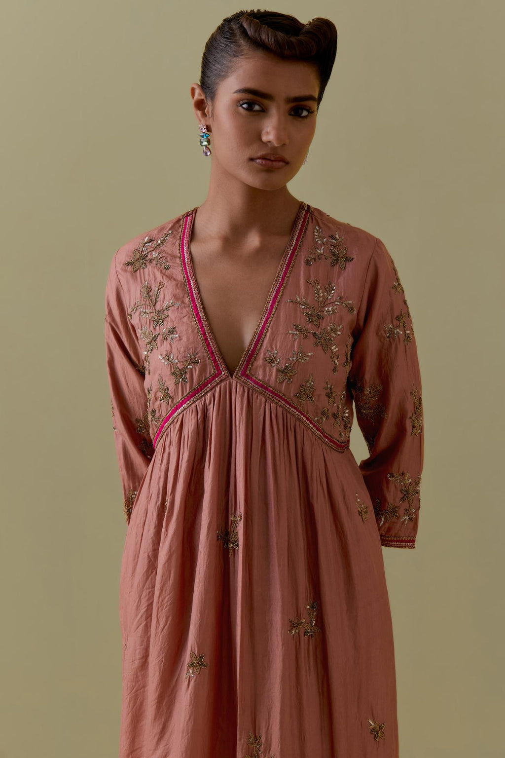 Peach silk Kurta set with hand worked Floral & Tree Motifs.