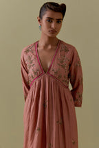 Peach silk Kurta set with hand worked Floral & Tree Motifs.