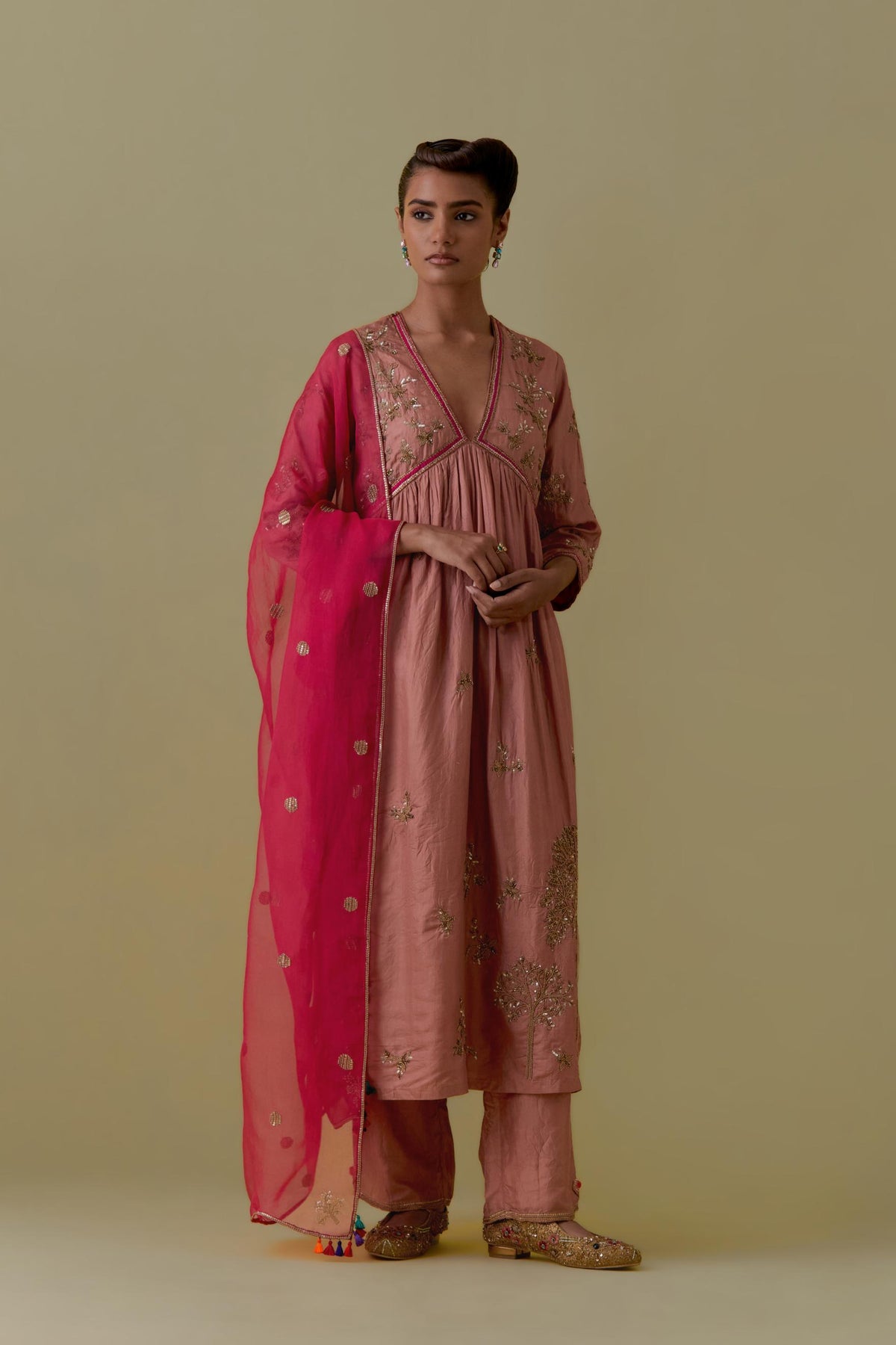 Peach silk Kurta set with hand worked Floral & Tree Motifs.
