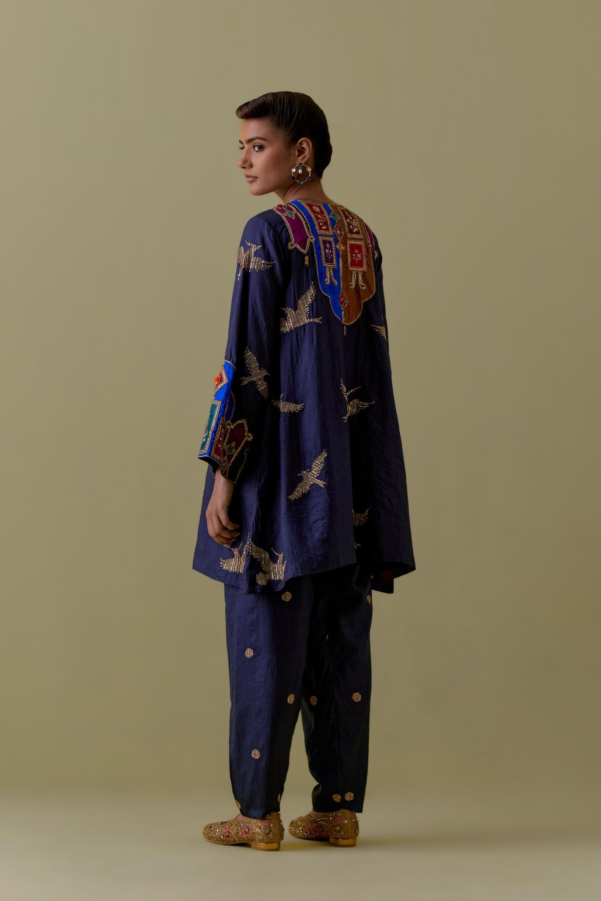 Indigo silk A-Line Kurta set with multicoloured appliqué & Hand-Worked Bird Motifs.